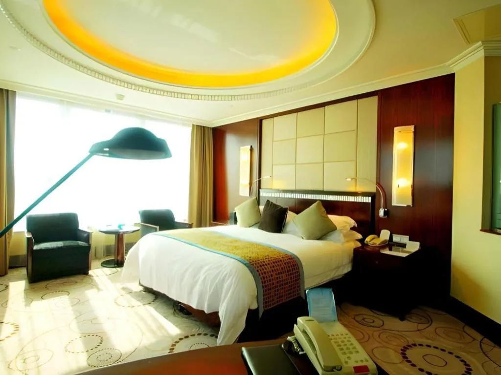 Bed in Grand Soluxe Zhongyou Hotel