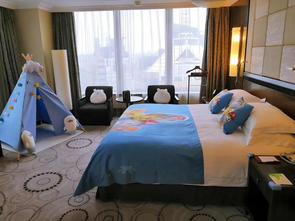 Bed in Grand Soluxe Zhongyou Hotel