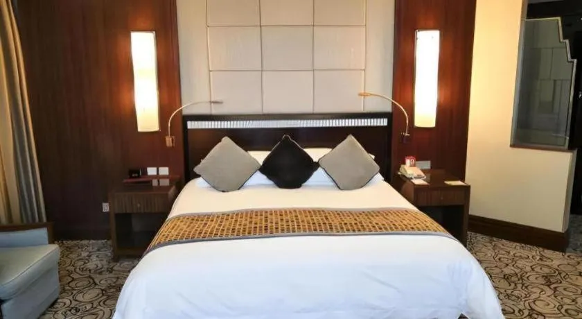 Bed in Grand Soluxe Zhongyou Hotel