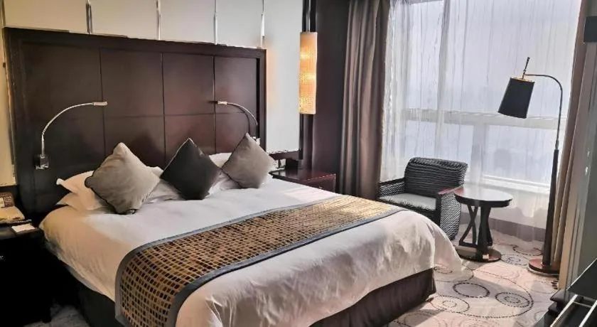 Bed in Grand Soluxe Zhongyou Hotel