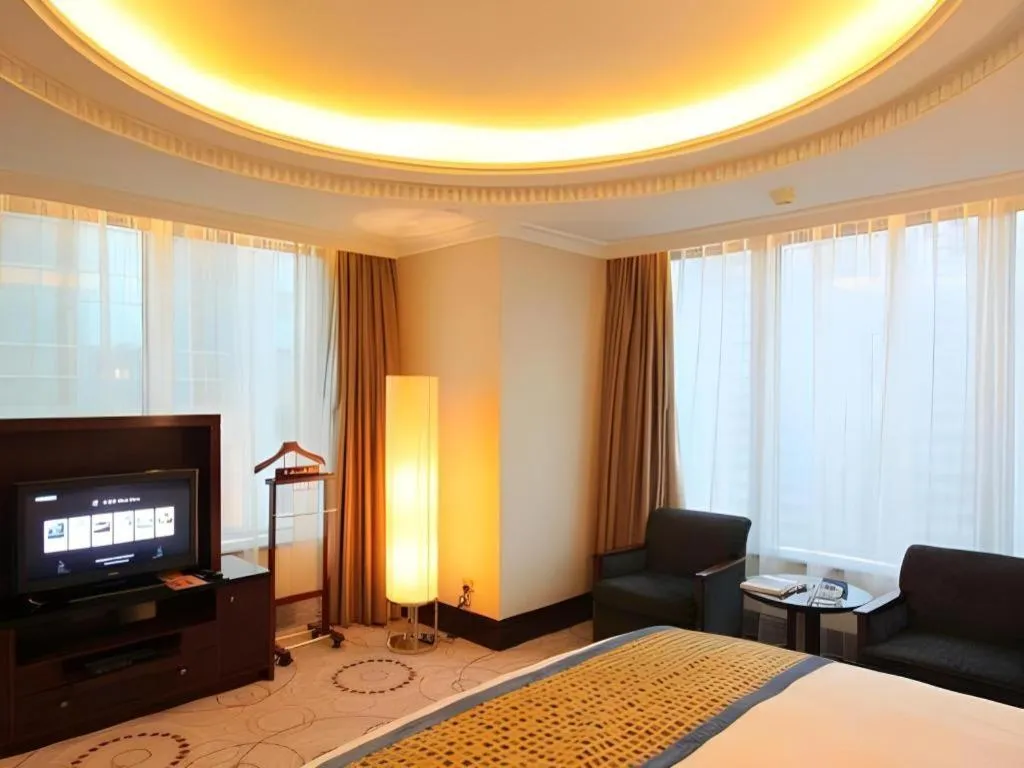 Bed in Grand Soluxe Zhongyou Hotel