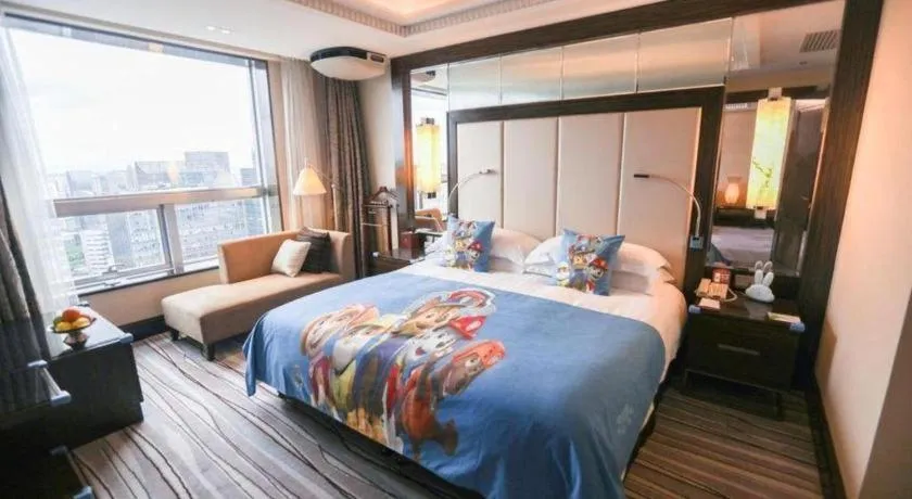 Bed in Grand Soluxe Zhongyou Hotel