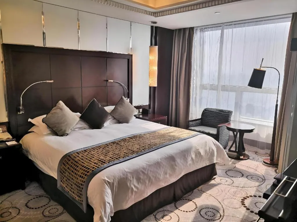 Bed in Grand Soluxe Zhongyou Hotel