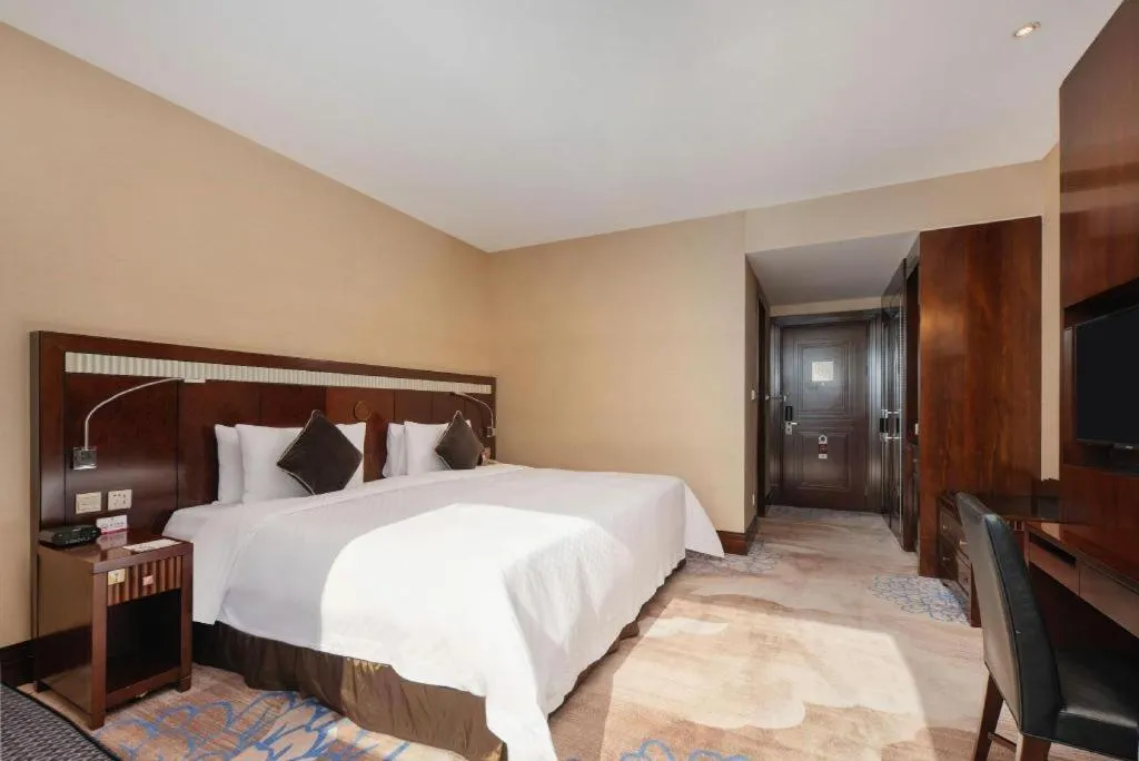 Bed in Grand Soluxe Zhongyou Hotel