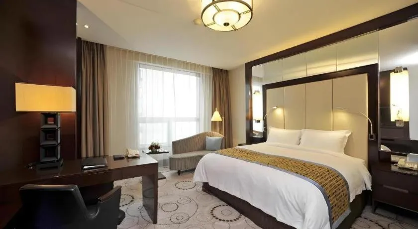 Bed in Grand Soluxe Zhongyou Hotel