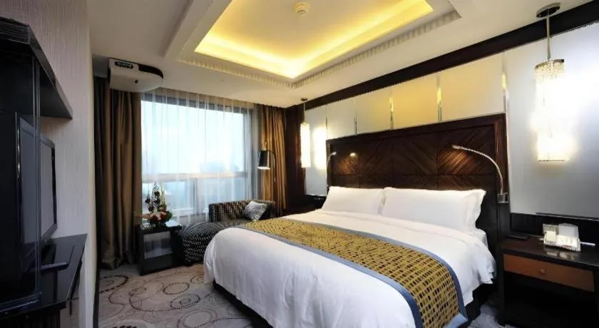 Bed in Grand Soluxe Zhongyou Hotel