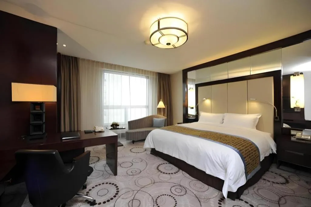 Bed in Grand Soluxe Zhongyou Hotel