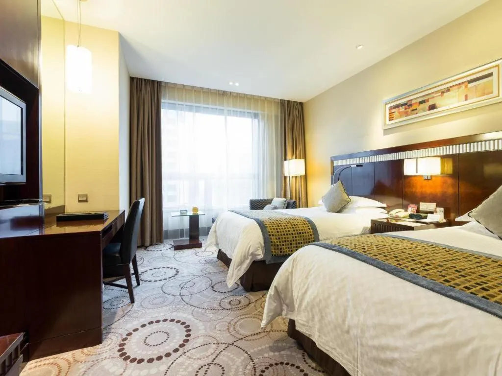 Bed in Grand Soluxe Zhongyou Hotel