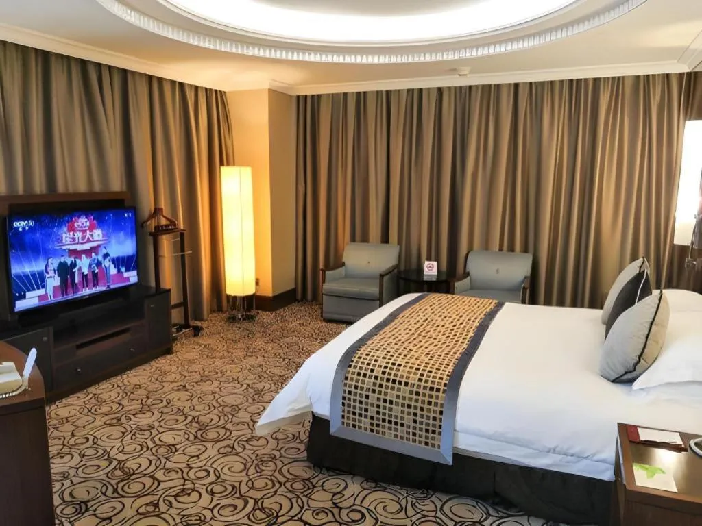 Bed in Grand Soluxe Zhongyou Hotel