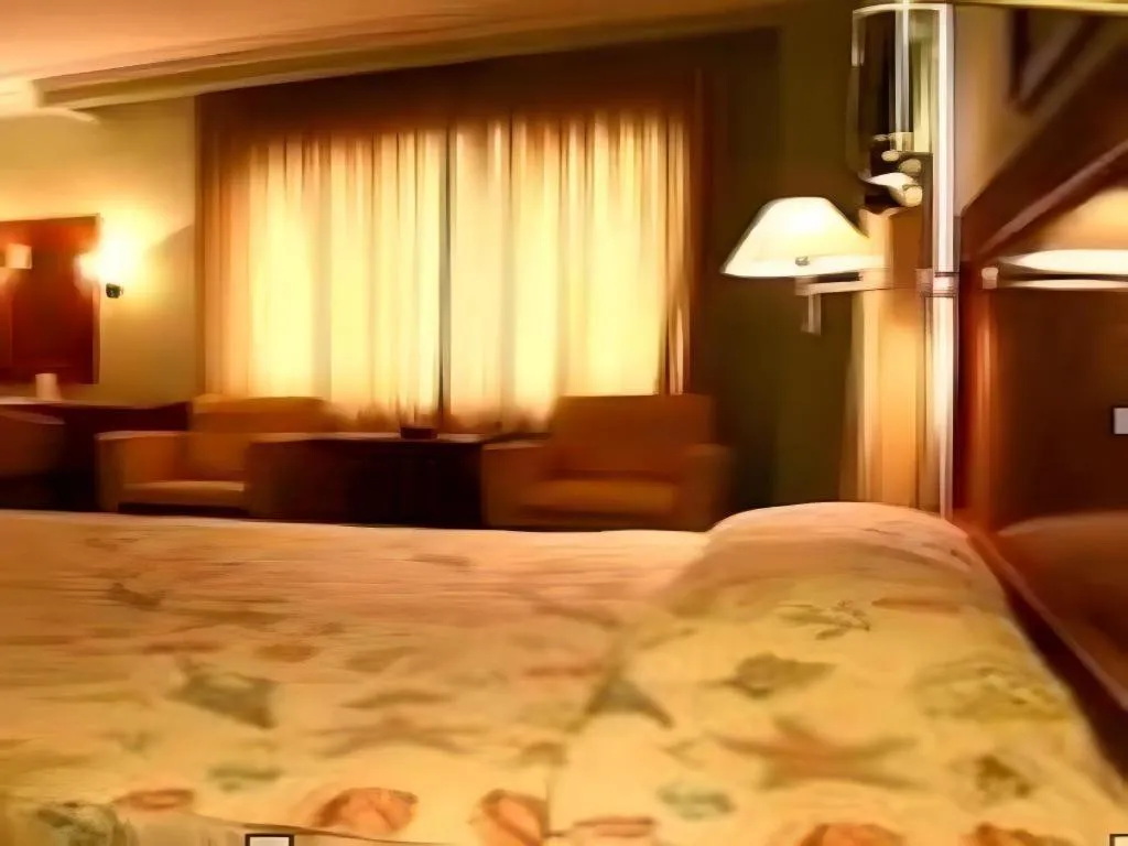 Bed in Nalendra Hotel