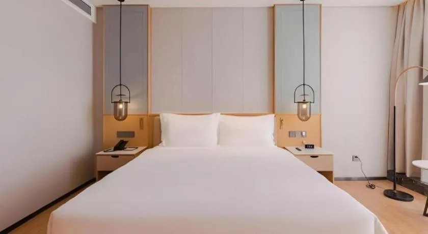 Bed in Hongfeng Hotel Nanshan Branch