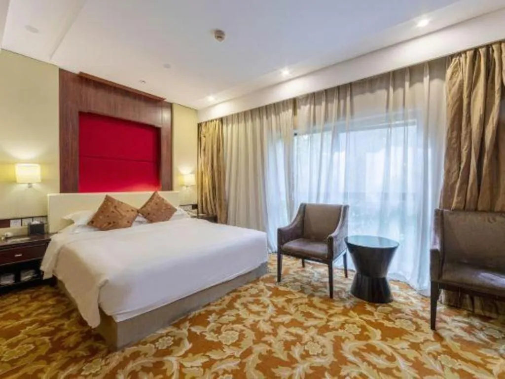 Bed in West International Trade Grand Hotel