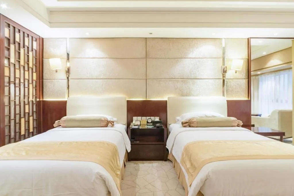 Bed in West International Trade Grand Hotel