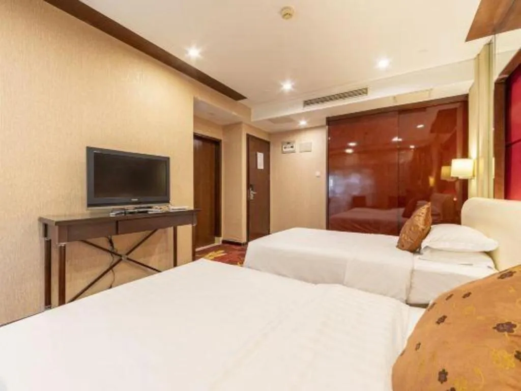 Bed in West International Trade Grand Hotel