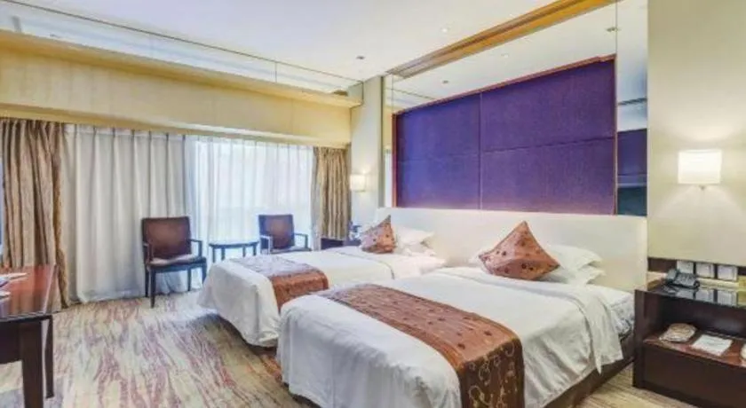 Bed in West International Trade Grand Hotel