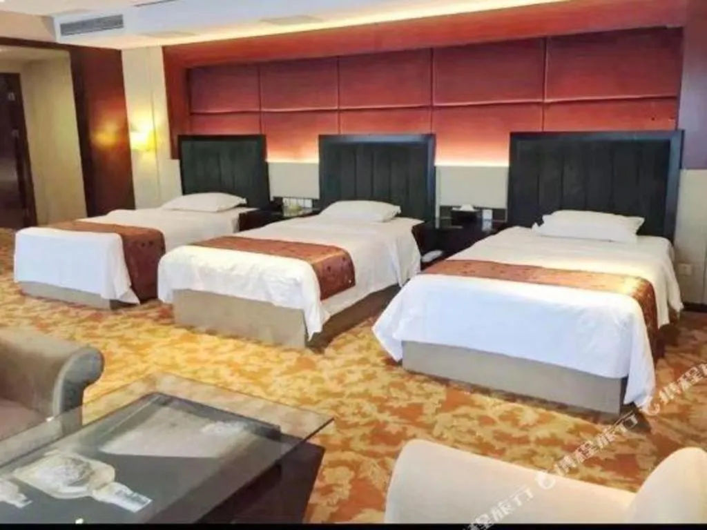 Bed in West International Trade Grand Hotel
