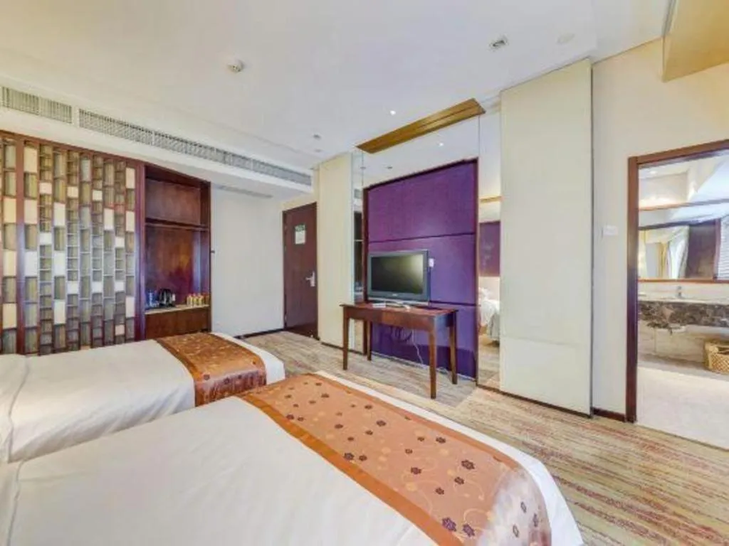 Bed in West International Trade Grand Hotel