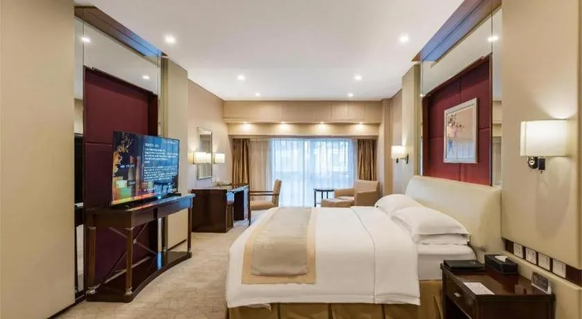 Bed in West International Trade Grand Hotel