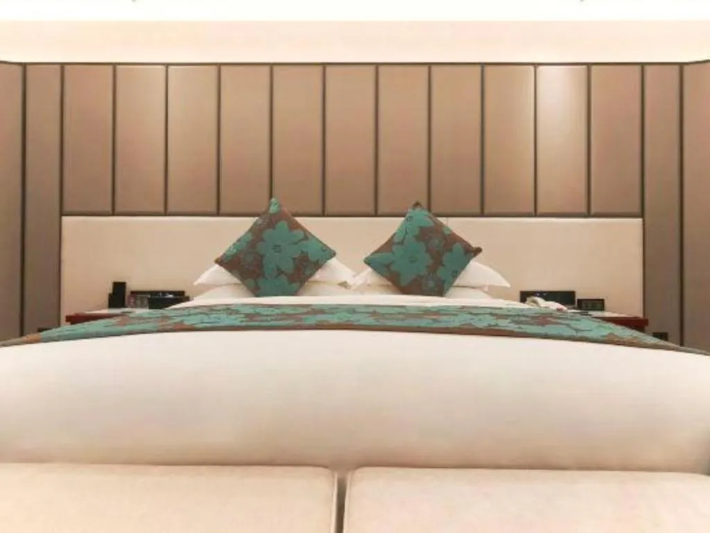 Bed in West International Trade Grand Hotel