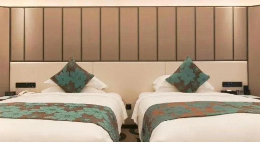 Bed in West International Trade Grand Hotel