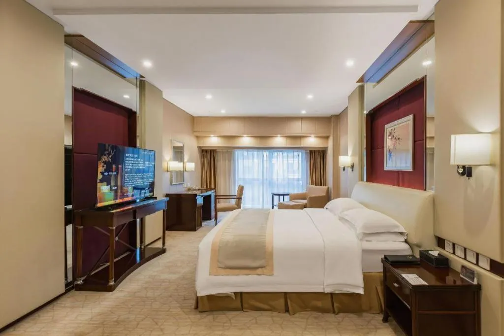 Bed in West International Trade Grand Hotel