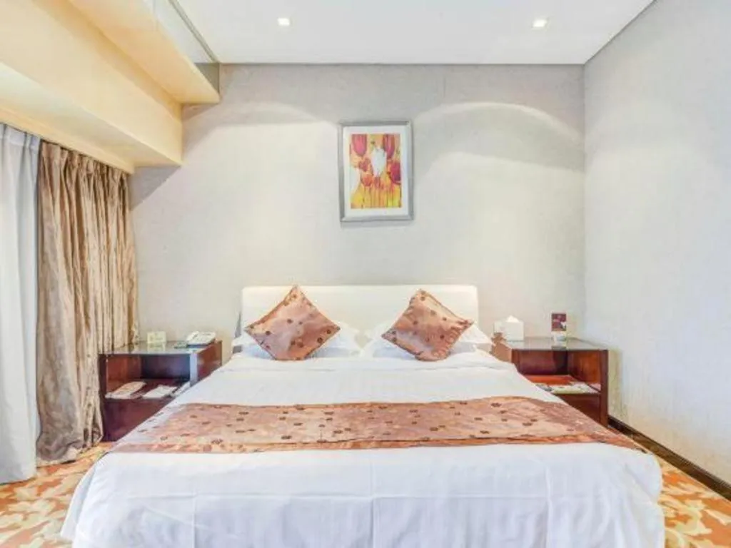 Bed in West International Trade Grand Hotel