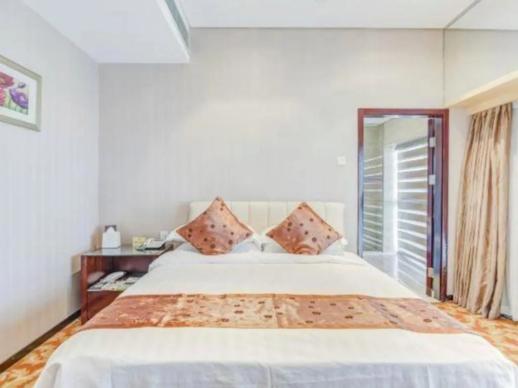 Bed in West International Trade Grand Hotel