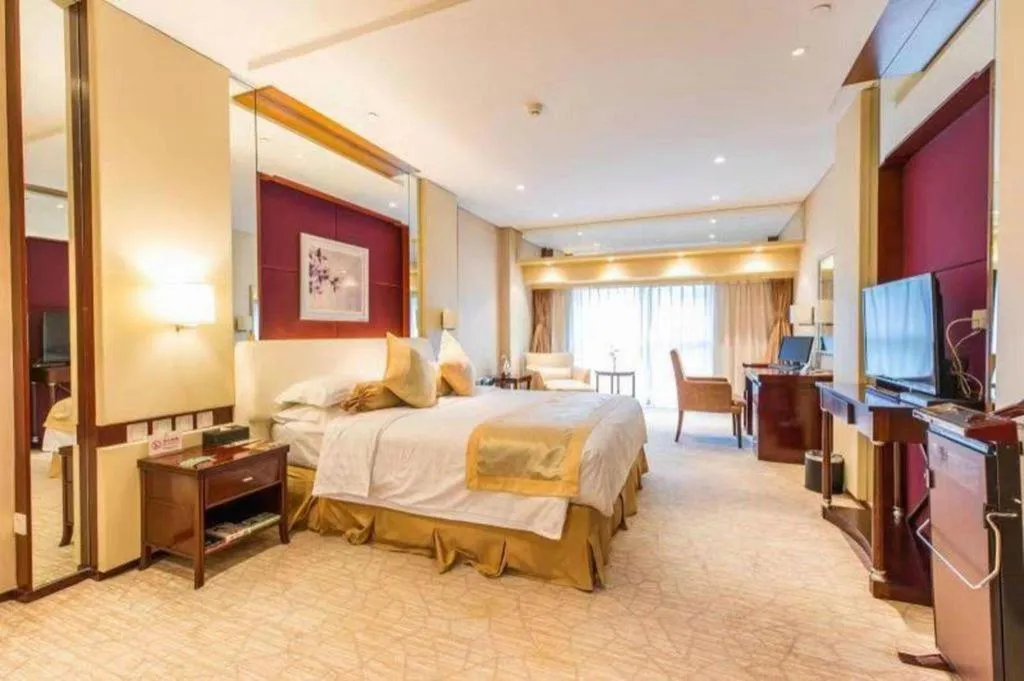 Bed in West International Trade Grand Hotel