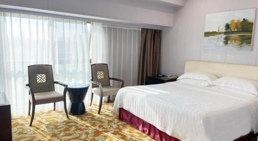 Bed in West International Trade Grand Hotel