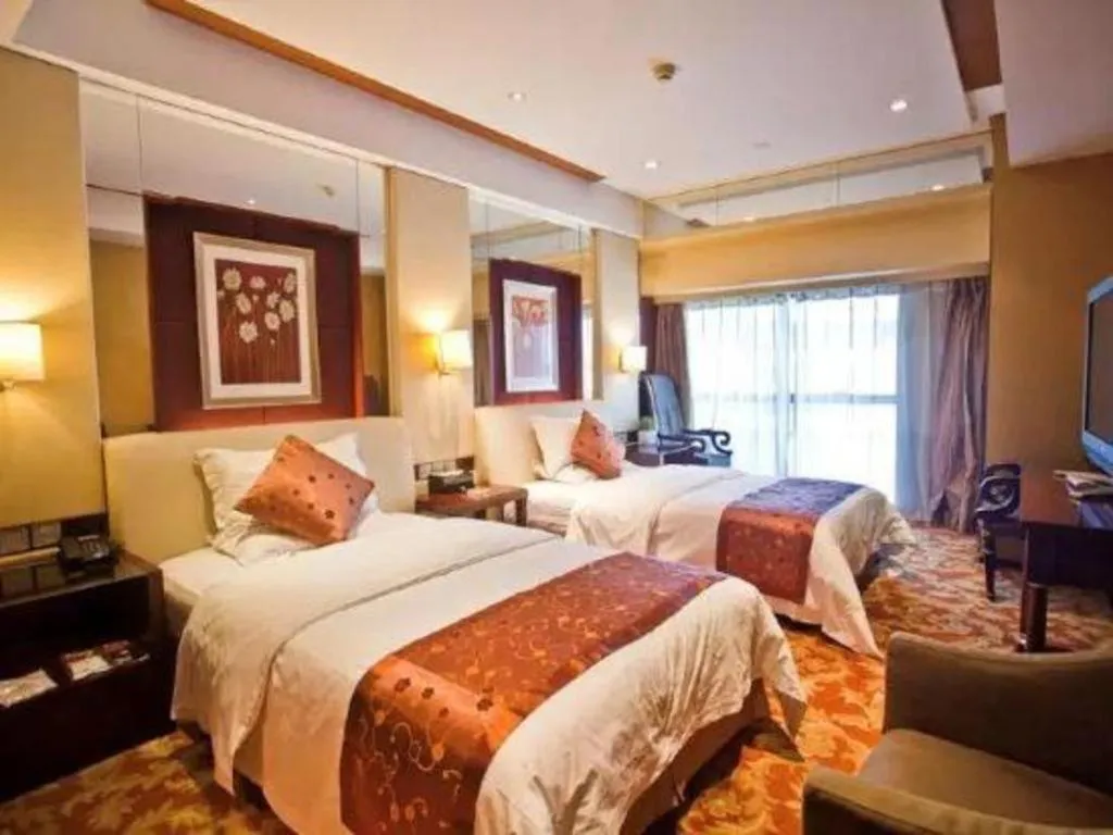 Bed in West International Trade Grand Hotel