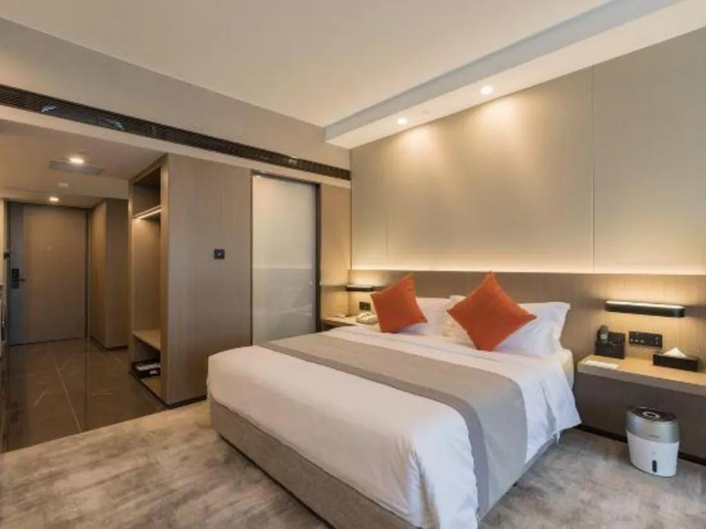 Bed in West International Trade Grand Hotel