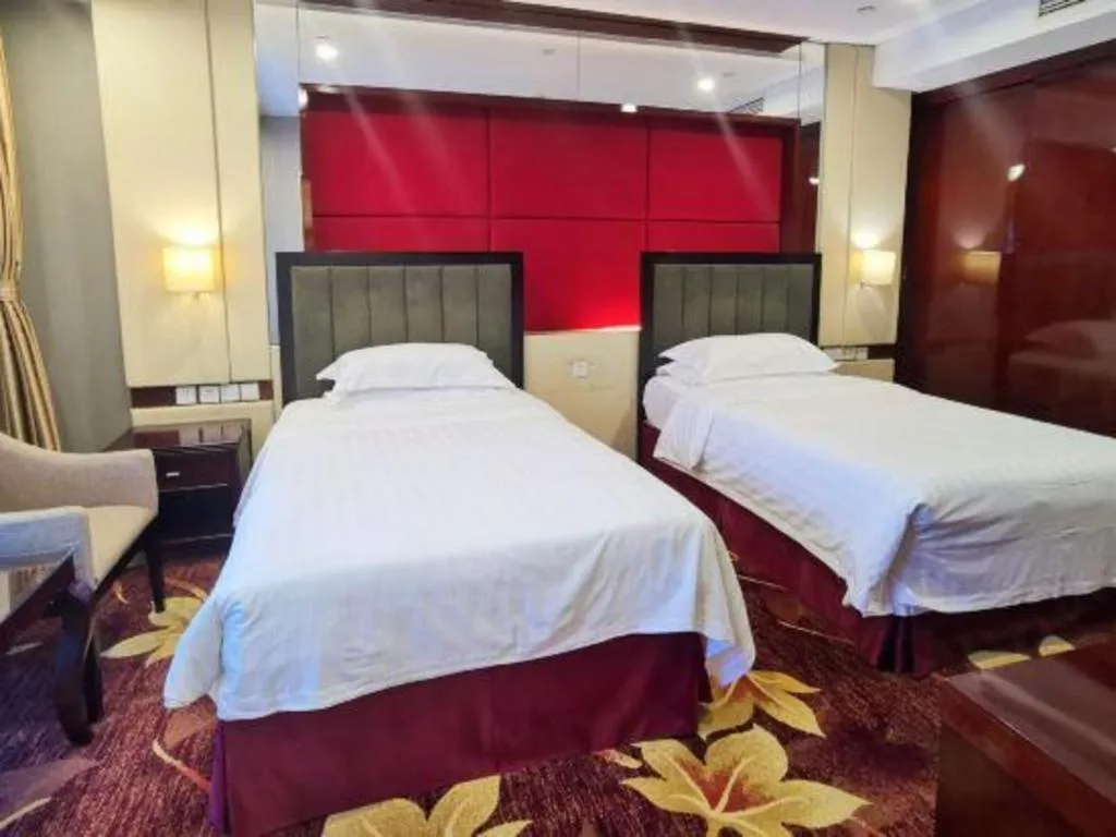 Bed in West International Trade Grand Hotel