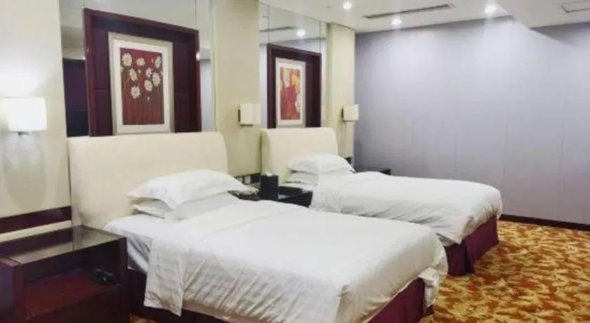 Bed in West International Trade Grand Hotel