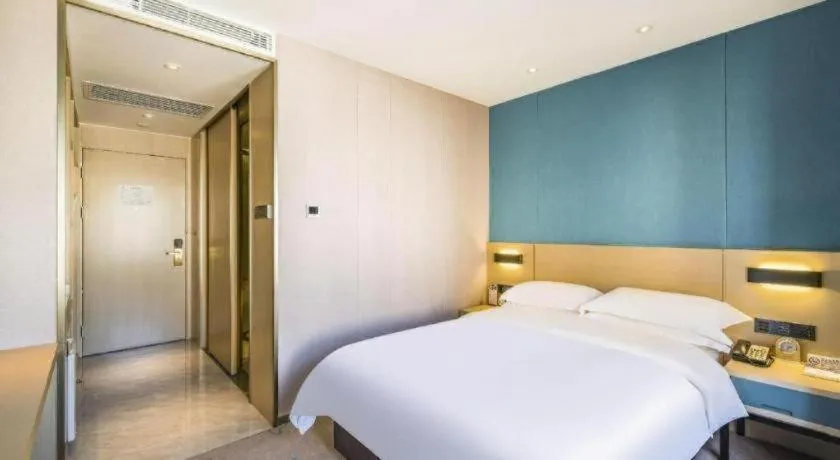 Bed in Beijing Ruyi Business Hotel