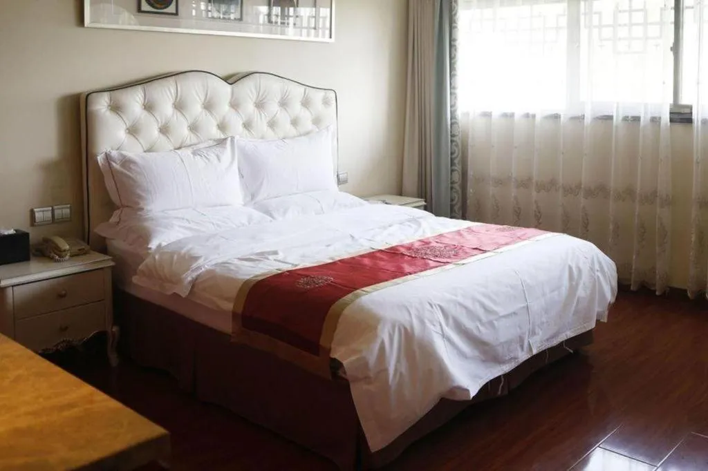 Bed in Yangzhou Hentique Huijin Resort Hotel