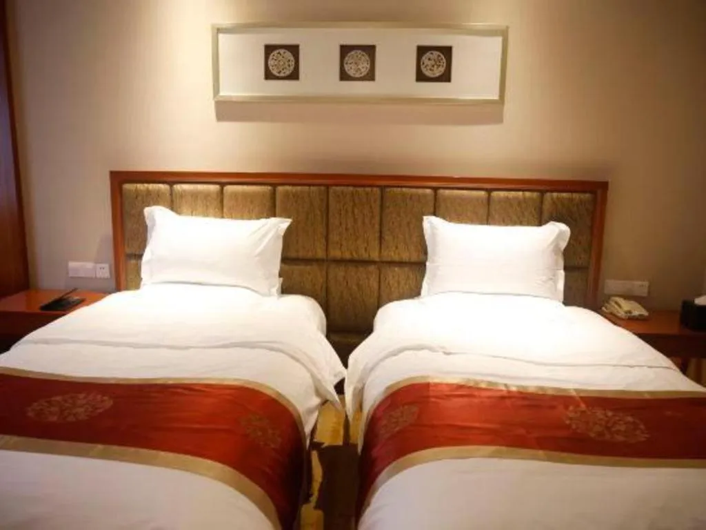 Bed in Yangzhou Hentique Huijin Resort Hotel