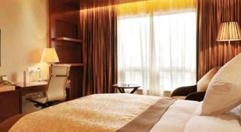 Bed in Yangzhou Hentique Huijin Resort Hotel