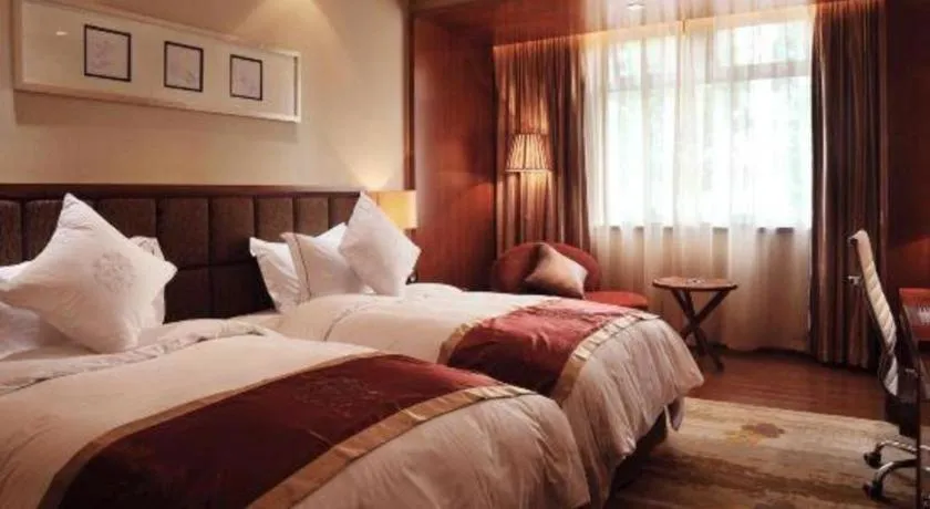 Bed in Yangzhou Hentique Huijin Resort Hotel