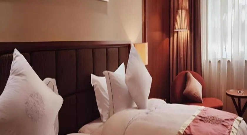 Bed in Yangzhou Hentique Huijin Resort Hotel