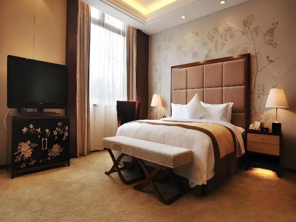 Bed in Yangzhou Hentique Huijin Resort Hotel