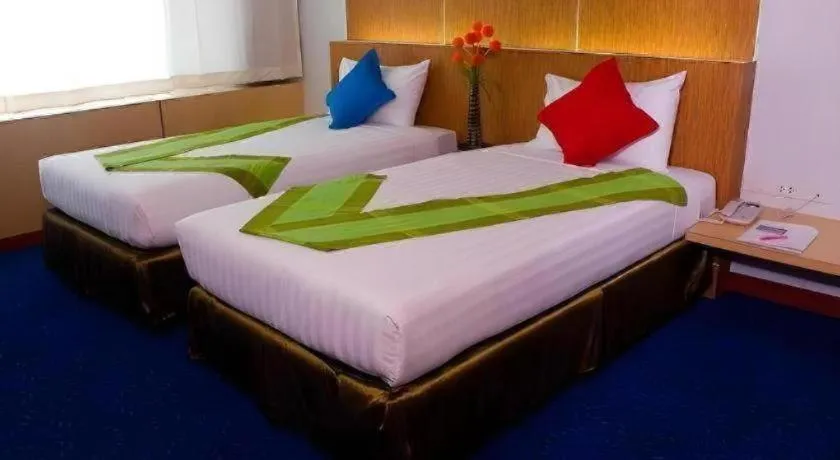 Bed in V-One Hotel Korat