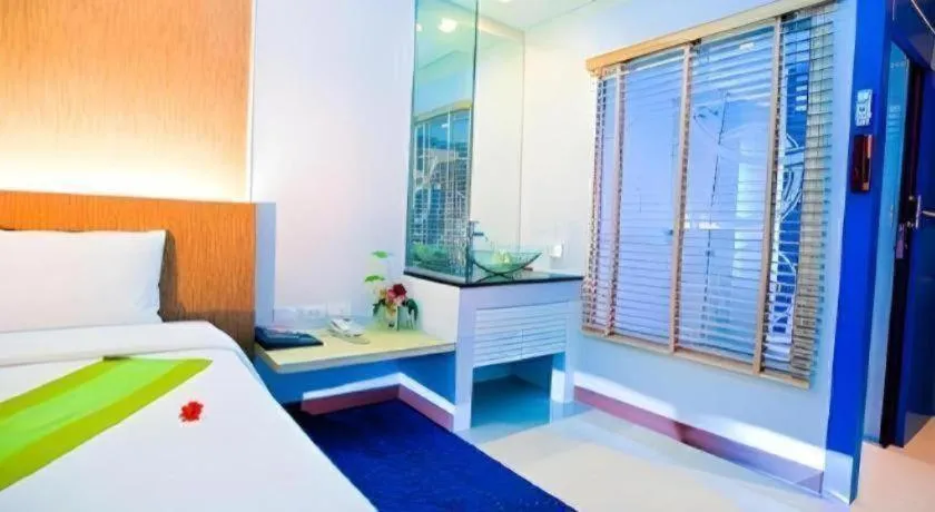 Bed in V-One Hotel Korat