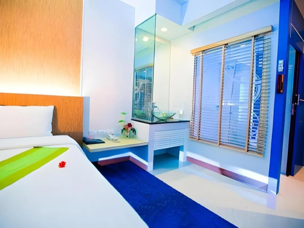 Bed in V-One Hotel Korat
