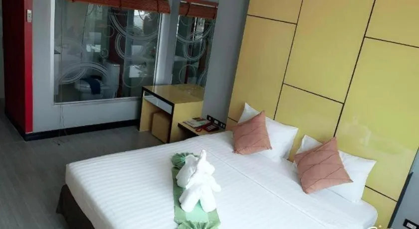 Bed in V-One Hotel Korat