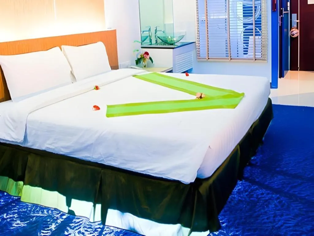 Bed in V-One Hotel Korat
