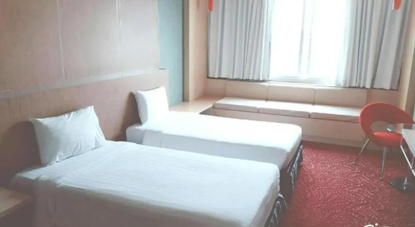 Bed in V-One Hotel Korat