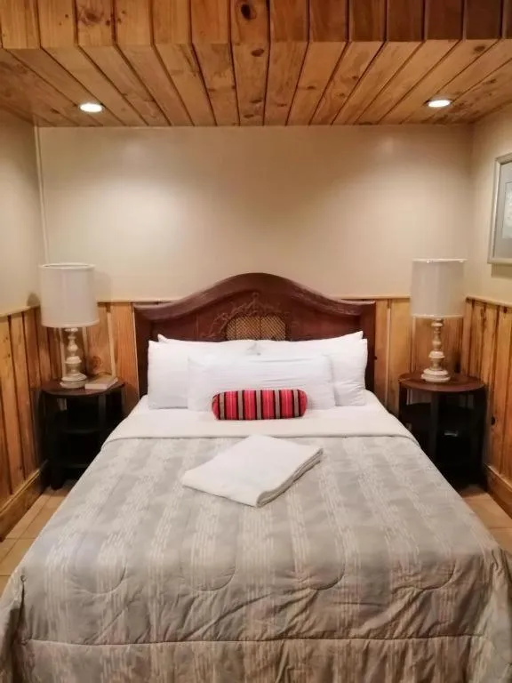 Bed in Mountain Lodge Hotel and Restaurant
