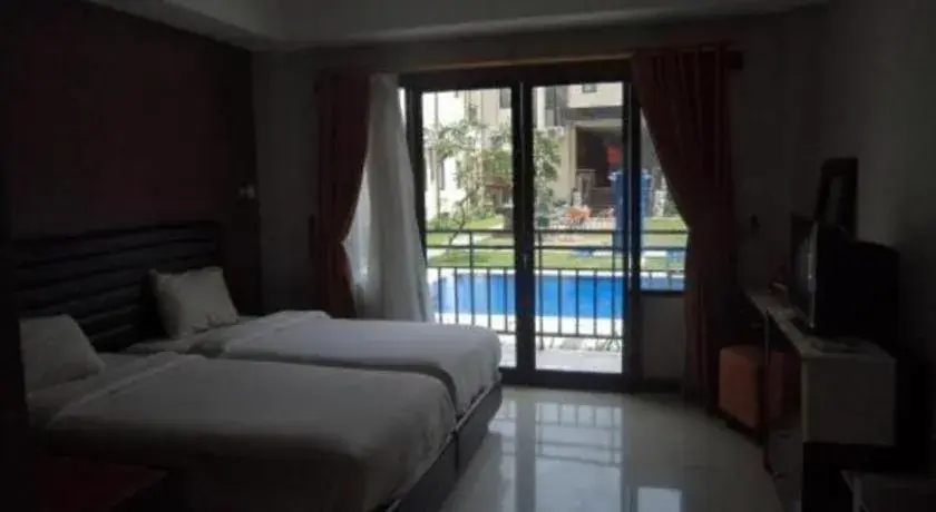 Bed in The Aroma's of Bali Hotel & Residence Bed in The Aroma's of Bali Hotel & Residence