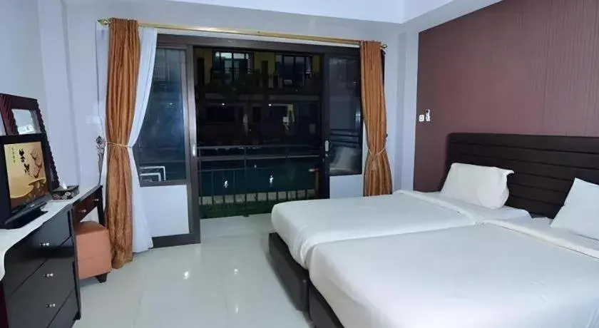 Bed in The Aroma's of Bali Hotel & Residence Bed in The Aroma's of Bali Hotel & Residence