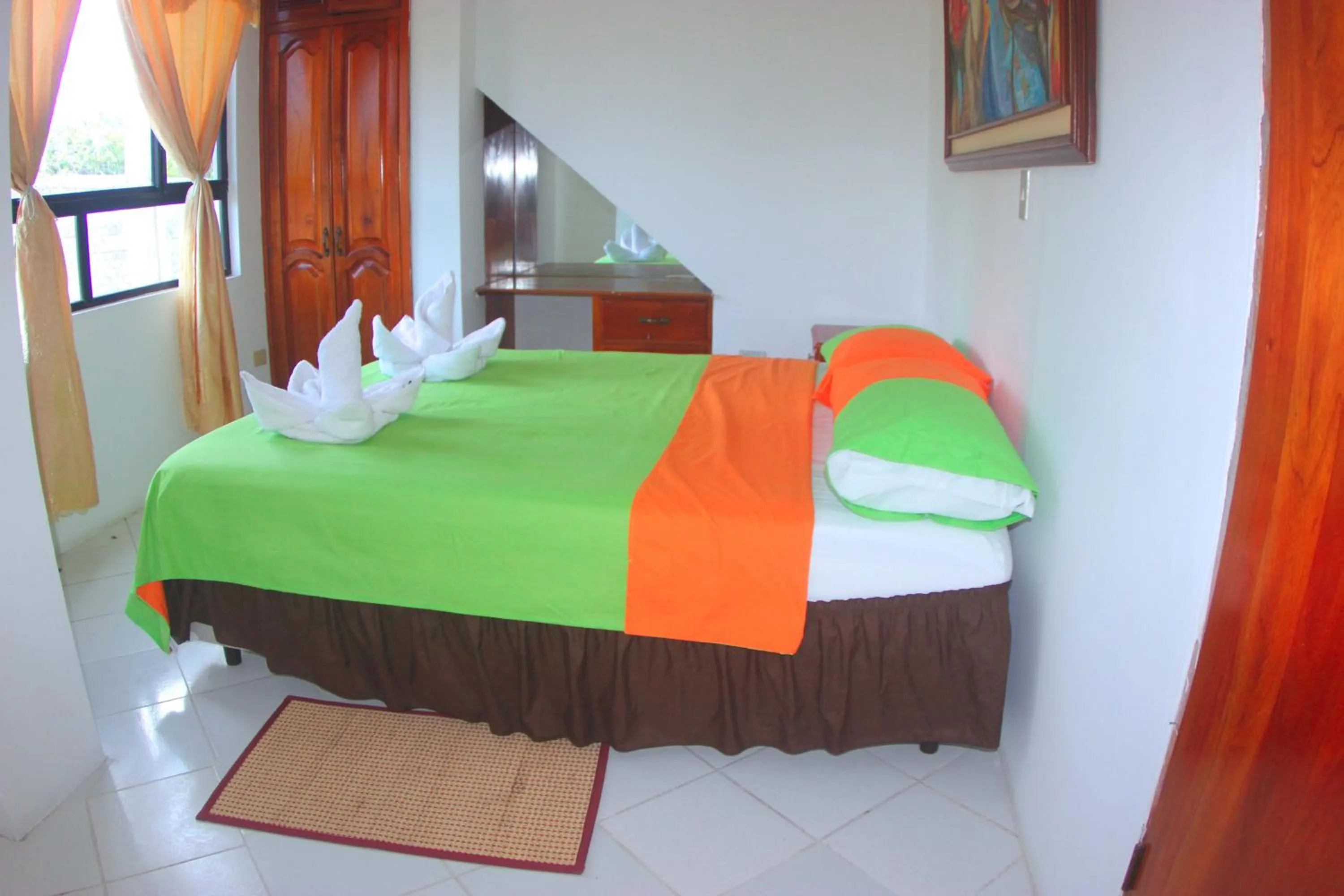 Photo of the whole room, Bed in The Island Home